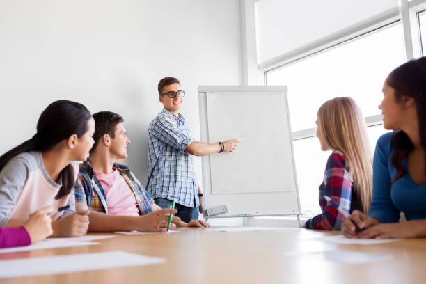 istock group of high school students with flip chart 1319234179