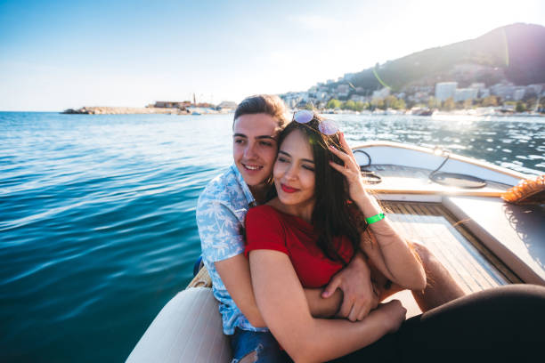 istock Young couple relaxing on boat at sea 1319234307