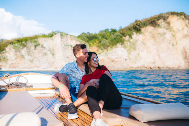 istock Young couple relaxing on boat at sea 1319234384