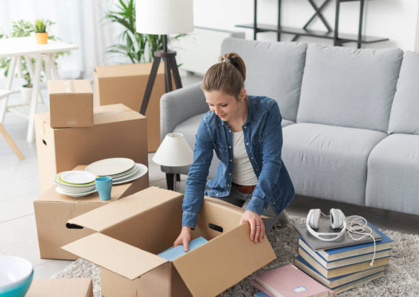 istock Woman unpacking in her new apartment 1319242301