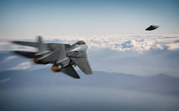 An American fighter jet pursues a UFO over a coastline somewhere