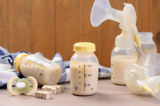 bottle of mother breast milk, breast milk storage and handling concept