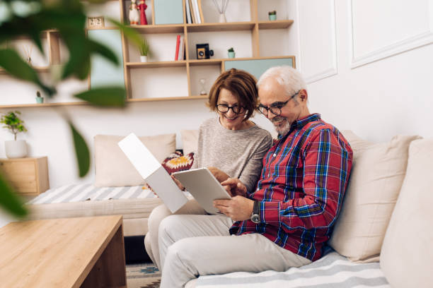 istock Happy senior couple using a digital delivery service to send a package 1319246032
