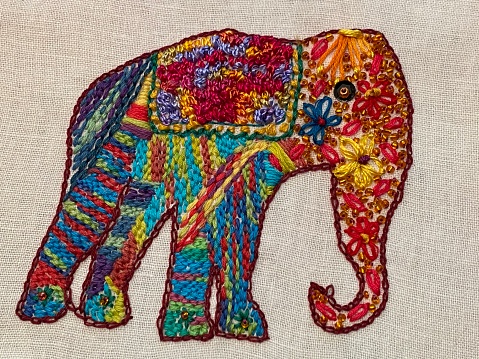 Hand embroidered by myself. This colourful elephant shows various embroidery stitches and beading anna linen background
