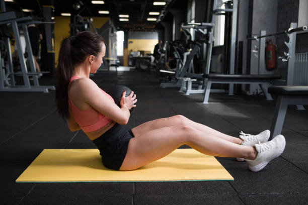 istock Sportswoman exercising at gym 1319252387
