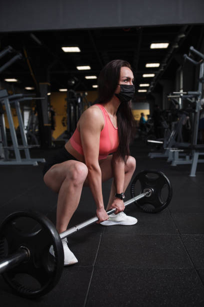 istock Sportswoman exercising at gym 1319252553