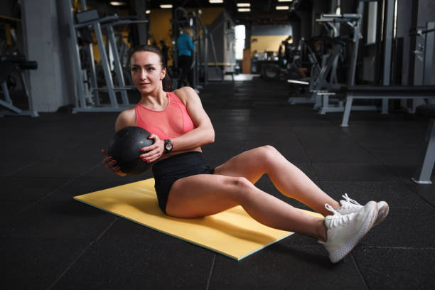 istock Sportswoman exercising at gym 1319252794