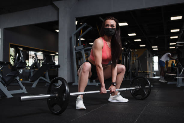 istock Sportswoman exercising at gym 1319252936