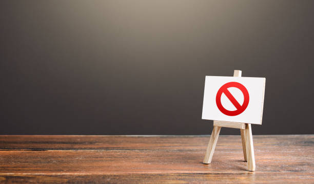 istock Easel with the prohibition sign NO. Restricted area. Restrictions and sanctions. Inaccessibility. Blocking. Out of stock. Ban and Embargo. Failed strategy. Denying entry, stopping action processes. 1319255125