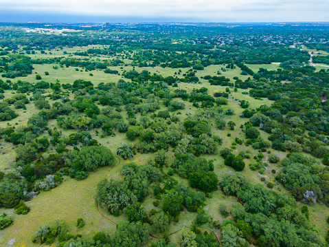 Aerial drone views high above Austin Texas Real Estate green Texas Hill Country surrounds the Capital City and urban city of Austin Texas south Austin Homes and Luxury Housing Suburb Neighborhood Circle C