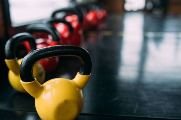 Colorful kettlebells in a row