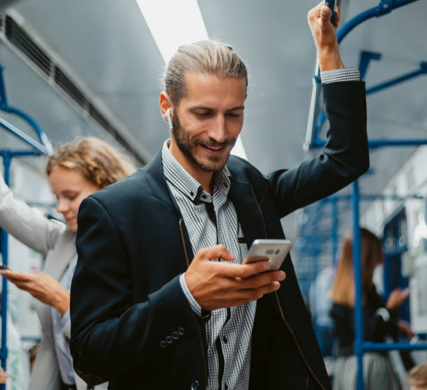 istock smiling passenger reading a message on his smartphone 1319258223