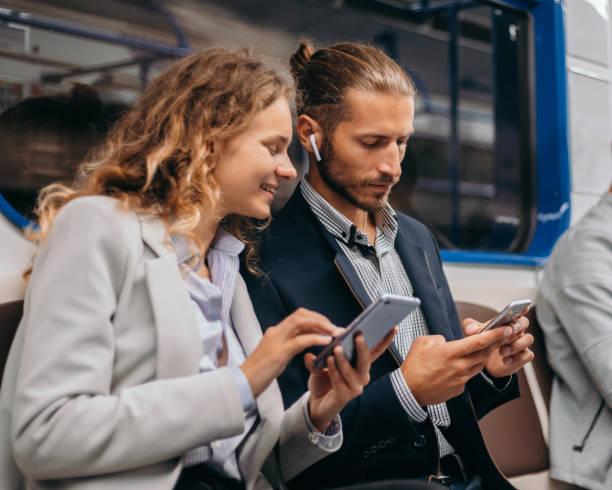 istock young couple communicates sitting in a subway car 1319258240