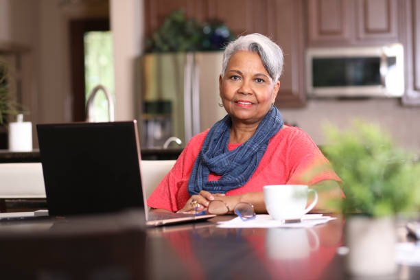 istock Senior adult woman using laptop computer at home. 1319261068