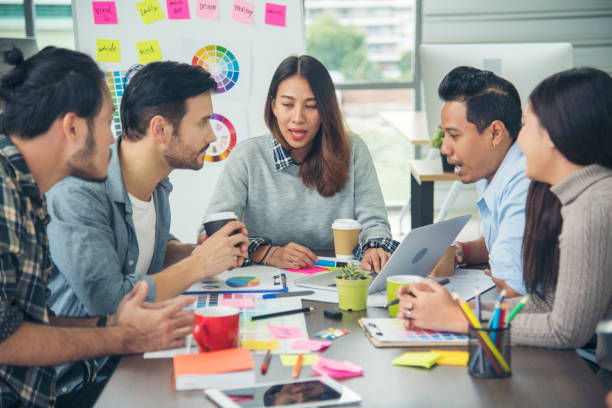 istock Creative design office center working teamwork. Happy business people partner plan strategy organization research people together at diversity office using laptop, smartphone company conference room 1319262379