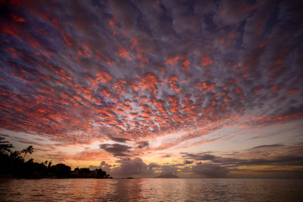 Seychelles sunset view. Pink sky sunset on tropical island. Background sunset concept. Seascape view on Seychelles. Honeymoon destination.