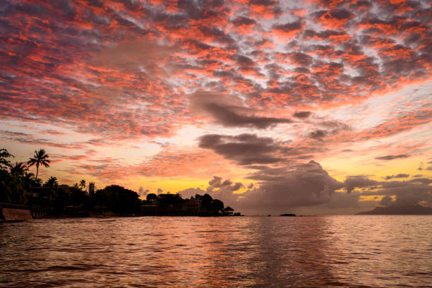 Seychelles sunset view. Pink sky sunset on tropical island. Background sunset concept. Seascape view on Seychelles. Honeymoon destination.