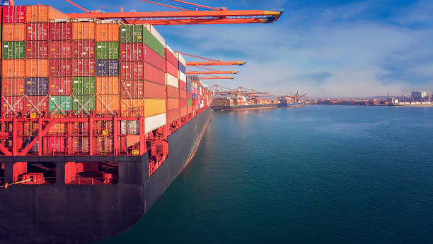 istock Container ship in an International port. 1319269369