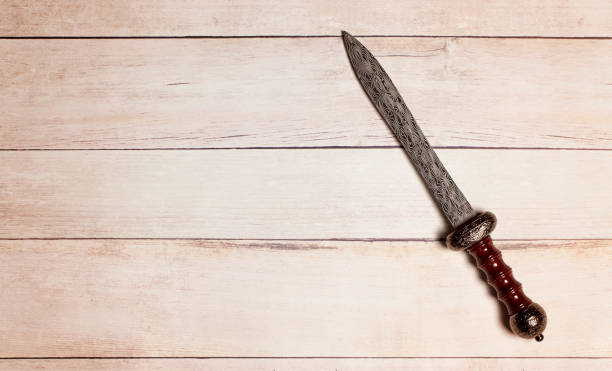 istock A Roman Gladius on a White Wooden Table 1319269896