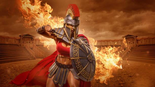 A female Warrior Gladiator holding a weapon in an arena A modern, superhero, comic book re-interpretation of a female Warrior Gladiator holding a weapon in an arena gladiator stock pictures, royalty-free photos & images