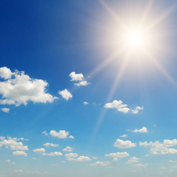 istock Sunny day background, blue sky with cumulus clouds and summer or spring sun as nature background. 1319272371
