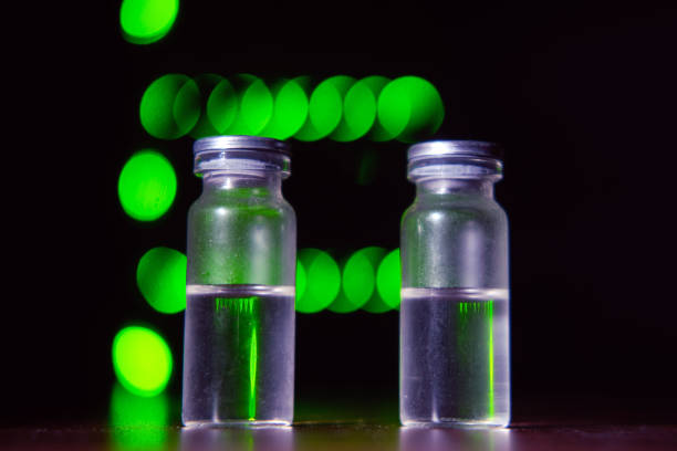istock High tech and vaccine vials, bokeh from server equipment lamps 1319273284