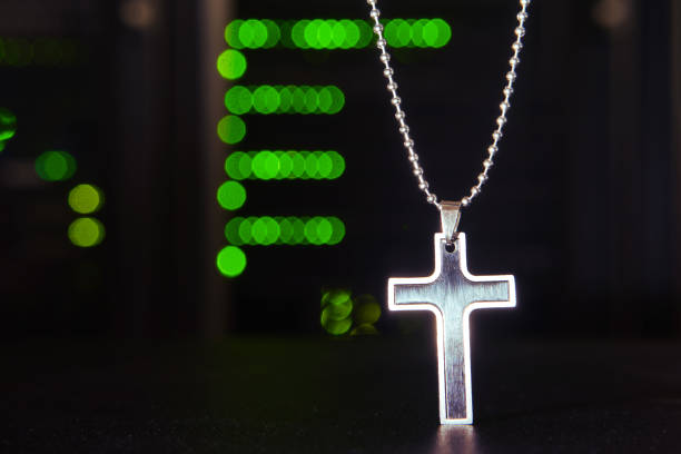 istock Christian cross on the background of computer technology in the server room 1319273294