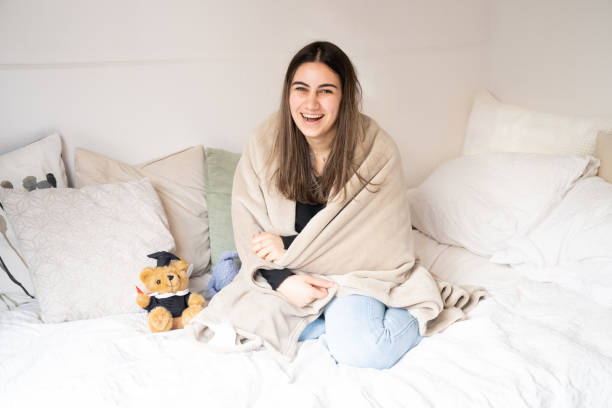 istock Young woman with blanket on her bed 1319275062
