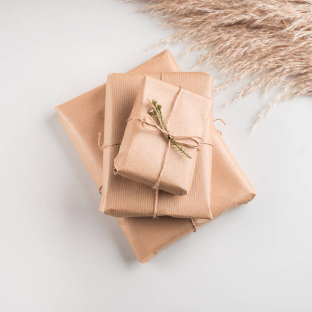 istock Gift box wrapped in craft paper with dried flowers 1319276255