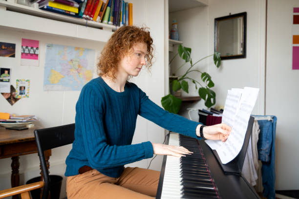 istock Young woman playing musical instrument 1319276373