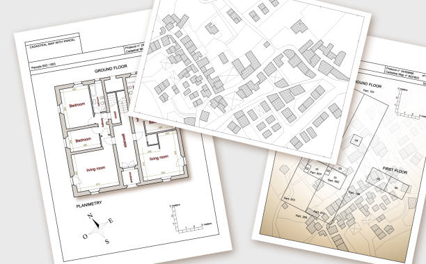 istock Updating public cadastral digital databases and information about land registry - concept image with an imaginary cadastral map of territory with buildings, roads and land parcel - Note: The map background is totally invented and does not represent any re 1319276404