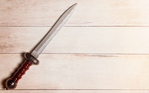 istock A Roman Gladius on a White Wooden Table 1319276525