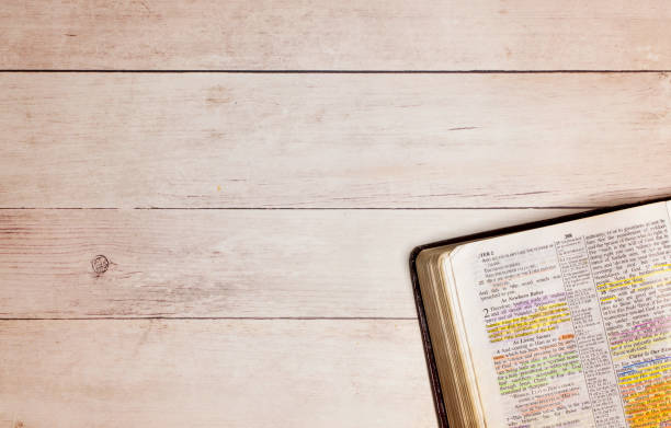 istock A Used and Highlighted Bible Open on a White Wood Table 1319278035