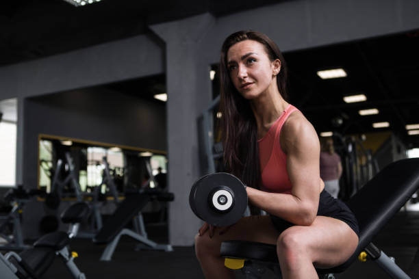 istock Sportswoman exercising at gym 1319283265