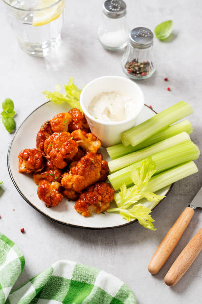 istock Barbecue cauliflower  with fresh celery sticks 1319283860