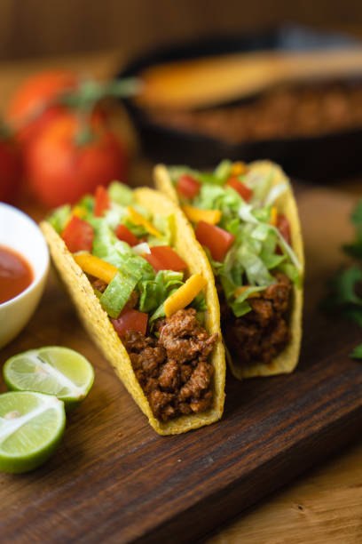 istock hard shell taco on wooden board with lime 1319284352