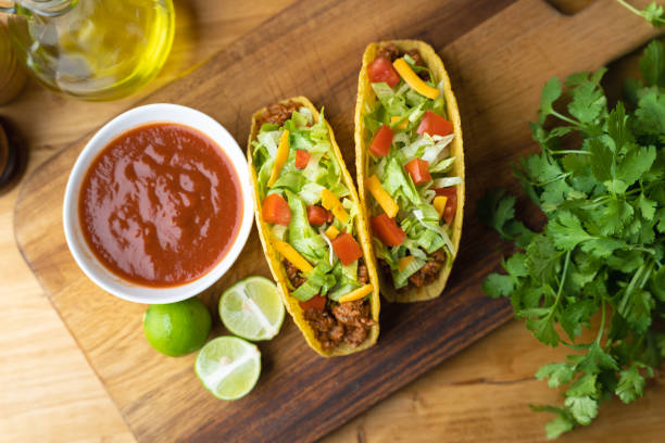 istock hard shell taco on wooden board with lime 1319284468