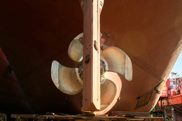 istock Variable pitch propeller and rudder. Cargo vessel ashore on ship repairing yard. 1319284501