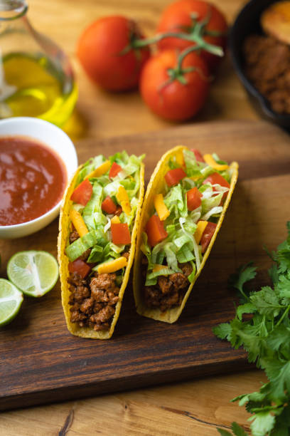 istock hard shell taco on wooden board with lime 1319284592