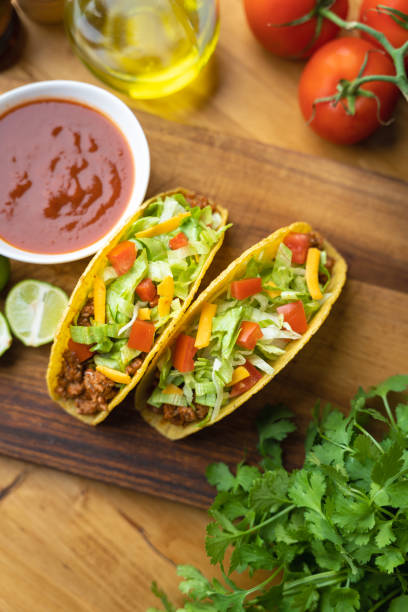 istock hard shell taco on wooden board with lime 1319284671