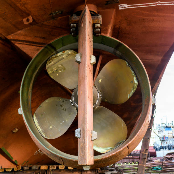 Variable pitch propeller and rudder. Cargo vessel ashore on ship repairing yard.