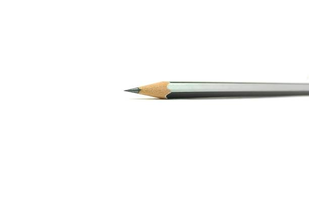 Macro picture of the tips of two pencils, yellow and black