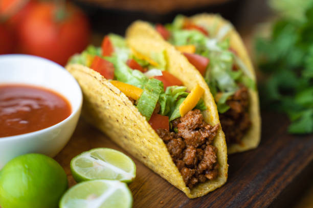 istock hard shell taco on wooden board with lime 1319285411