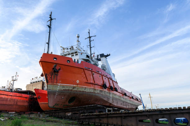 istock Tug vessel ashore on ship repairing yard. Summer time. 1319285414