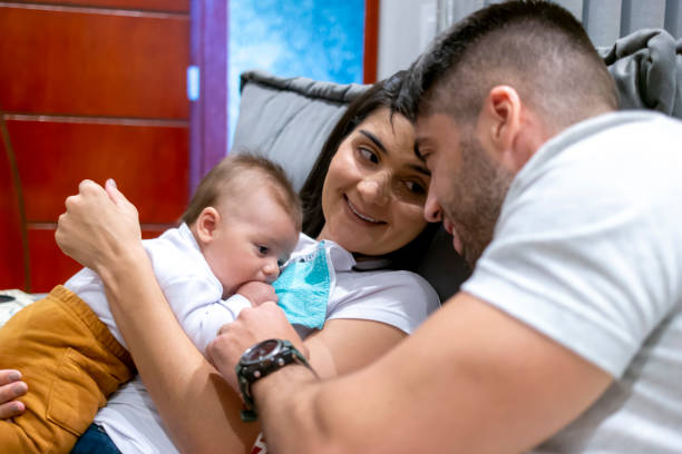 istock Mother and father with a baby. 1319285509