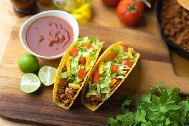 istock hard shell taco on wooden board with lime 1319285575