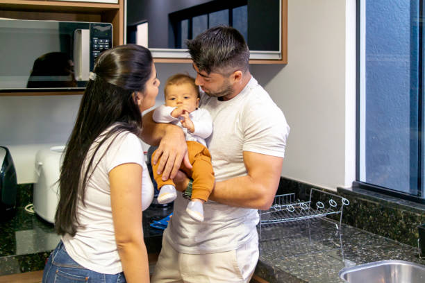istock Mother and father with a baby. 1319285772