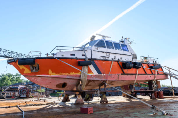 istock Small sized vessel ashore on ship repairing yard. Summer time. 1319285863