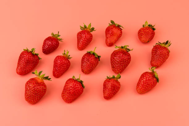 istock Strawberries on pink background. Strawberries berries pattern. Creative food concept. Flat lay, top view, copy space 1319286922
