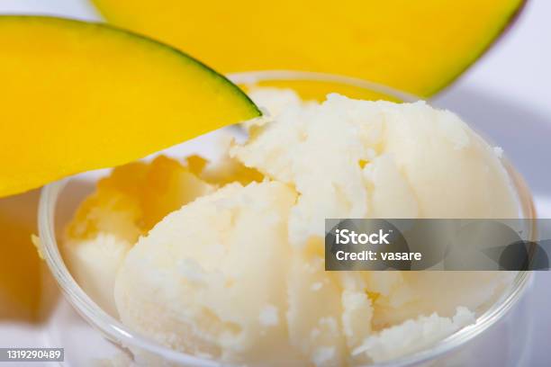 Mango Butter And Fresh Mango Fruit Close Up Organic Cosmetic Skin Care Spa Concept Stock Photo - Download Image Now